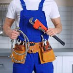 Plumber holding plumbing tools Jupiter, FL